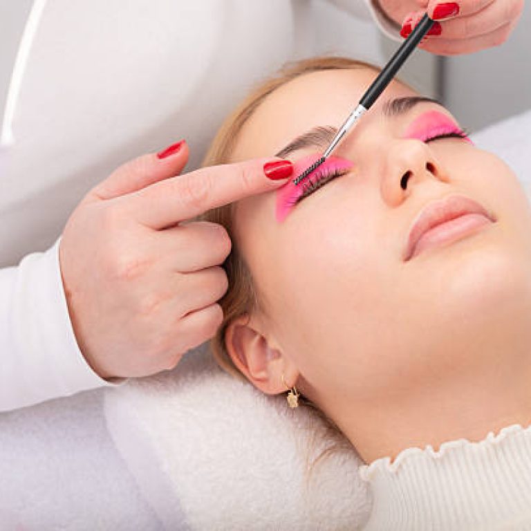 Beautiful young woman getting lash lamination beauty treatment in the modern beauty spa.