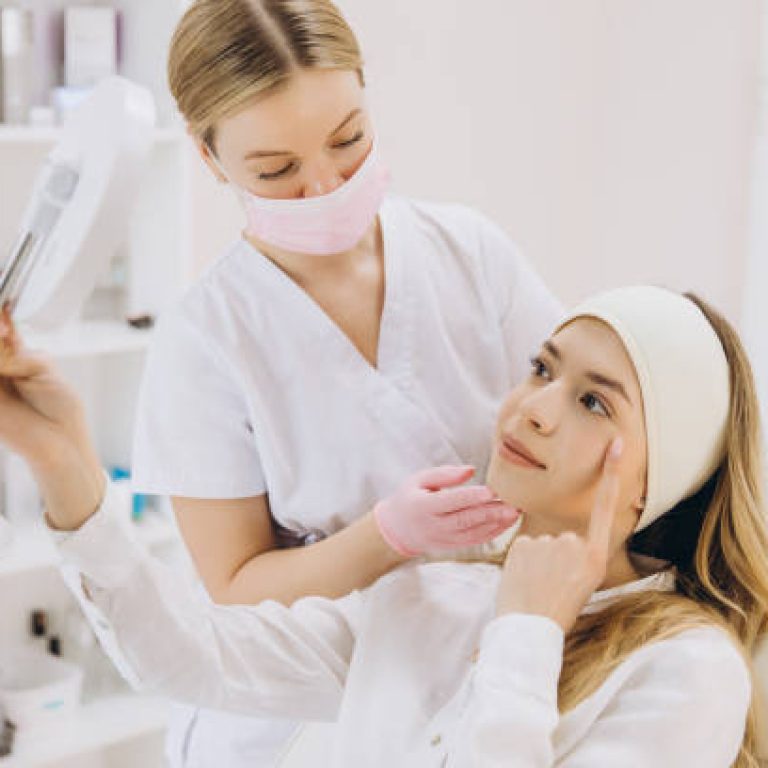 Medical professional displaying botox injection outcome, reflecting patient's transformed appearance with handheld mirror